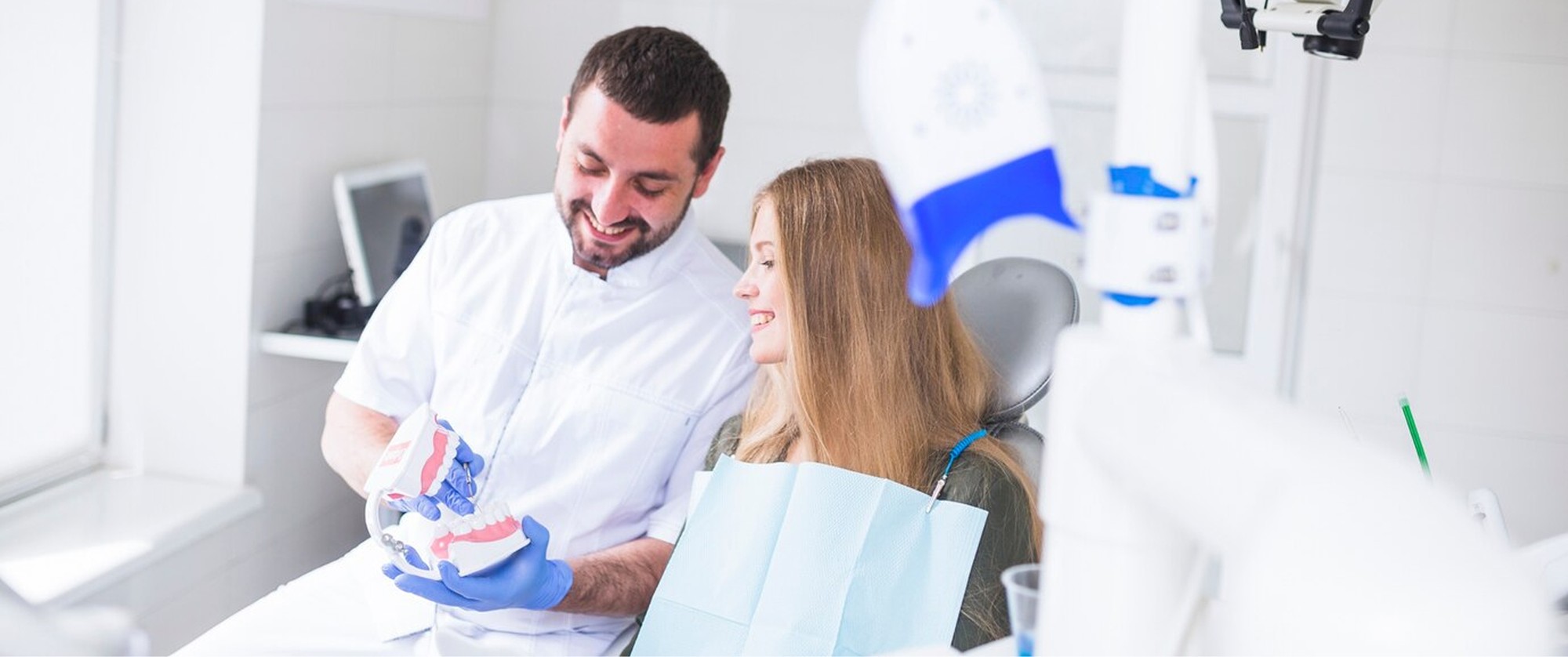 doctor educating patient in a dental clinic